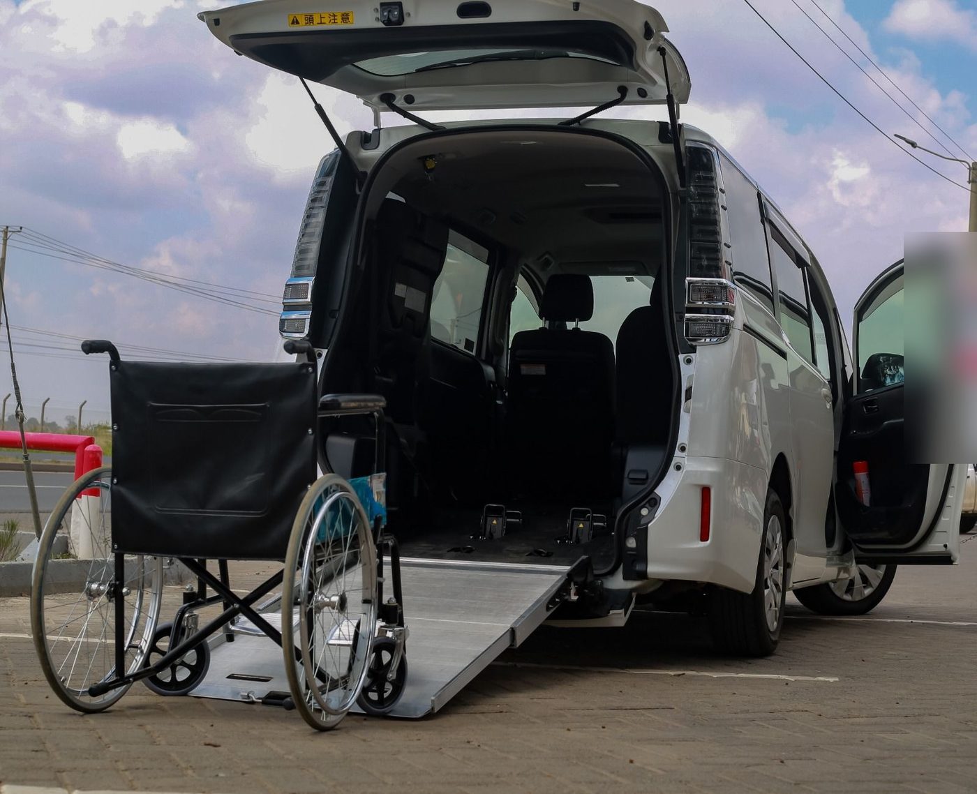 Fold-out wheelchair ramp in use